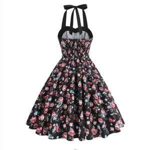 Vintage 1950s floral halter dress with pink roses on black fabric and A-line skirt
