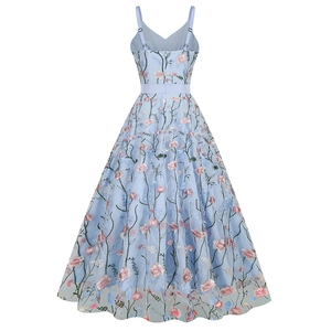 Detail view of floral embroidery on a light blue V-neck mesh dress from the back perspective