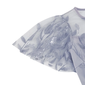 Detail of lavender mesh dress featuring leaf embroidery and sparkling silver sequins