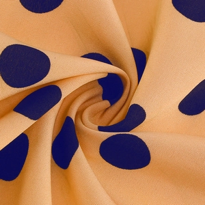 Macro shot of retro polka dot fabric texture with soft drape and weave details
