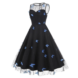Detail of delicate 3D blue butterfly appliques on black mesh sleeveless evening dress