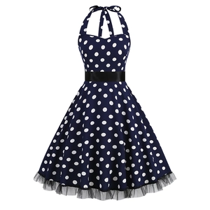 Vintage navy blue polka dot halter dress with black satin belt and lace hem detail
