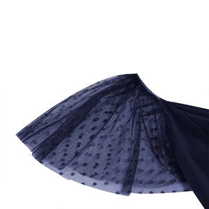 Close-up of navy blue mesh fabric with classic polka dots over high-quality lining