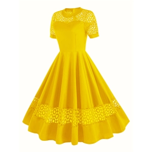Detail of elegant yellow vintage cocktail dress with intricate lace cutout patterns