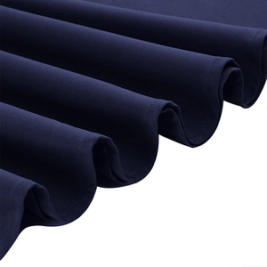 Close-up detail of navy blue mesh fabric with wavy pleats and refined texture on the dress