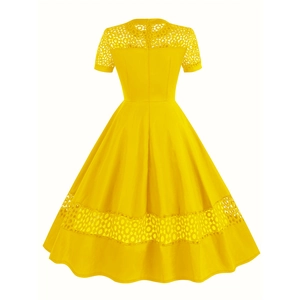 Detail of yellow cocktail dress featuring round neck and geometric hollow lace splicing