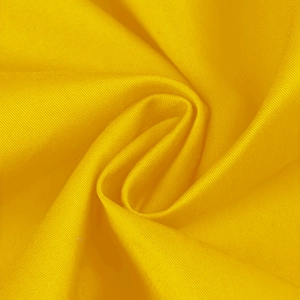 Close-up of bright yellow twill fabric with spiral folds for 50s cocktail dress