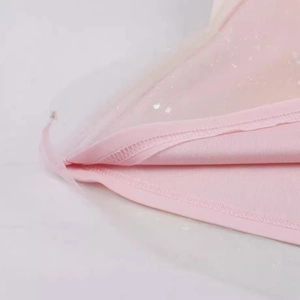 Pink sequin tulle halter cocktail dress featuring a tiered hem and a metallic finish