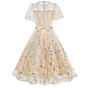 Detail view of champagne gold mesh dress back with sequin embroidery and satin waist bow