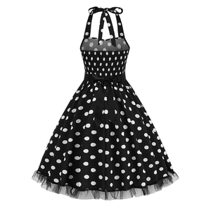 Detail of polka dot dress with elastic pleated back and black satin bow waistband