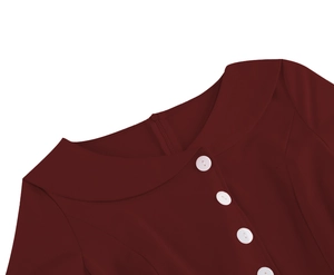 Close-up of retro dark red dress collar with white buttons and hidden back zipper