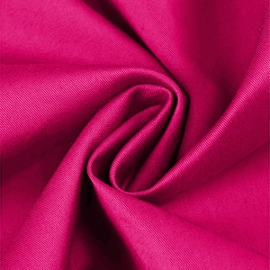 Close-up of rose red twill fabric detail with premium textured weave and subtle shine