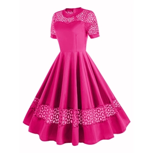 Detailed close-up of rose pink cocktail dress featuring intricate floral lace stitching