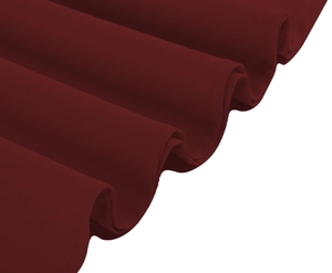 Detailed macro view of burgundy vintage dress fabric showing soft draping and fine texture