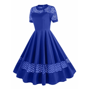 Detail of royal blue vintage dress with lace patchwork neckline and hollow out hem design