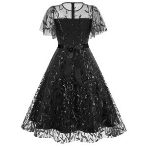 Detail view of black vintage mesh dress featuring silver leaf embroidery and back ribbon bow