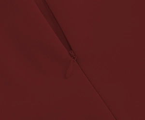 Detail view of high-quality invisible zipper on a vintage wine red button dress