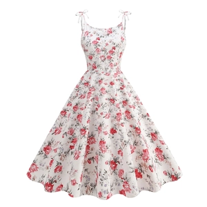Vintage 50s floral cocktail dress with rose print, bow straps and button details