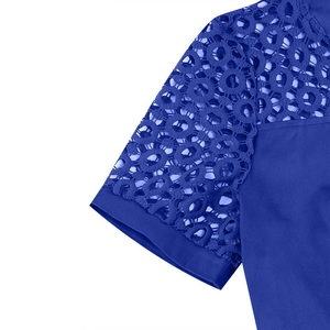 Detailed close-up of the royal blue hollow lace embroidery on the shoulder and sleeve