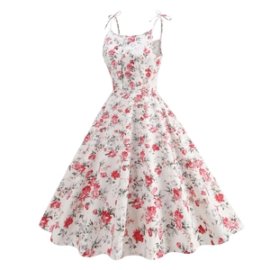 Detail of the vintage 1950s floral dress with tie-up bow straps and a white base print