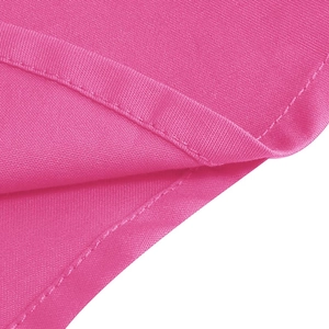 Close-up of rose red fabric texture and precise stitching on the retro children's dress