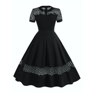 Detail of the back hidden zipper and geometric lace splicing on black cocktail dress