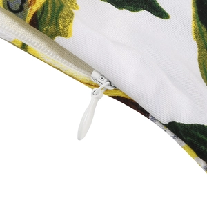 Detail of white invisible zipper on floral vintage dress fabric with yellow flowers