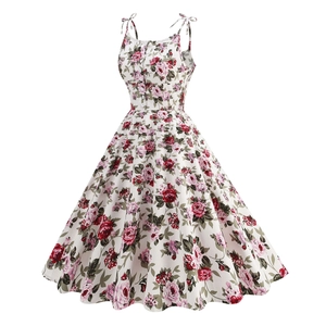 Detailed close-up of rose floral print pattern and decorative front buttons on retro dress