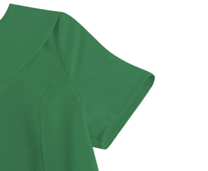 Close-up of green vintage dress showing shoulder stitching and textured fabric quality