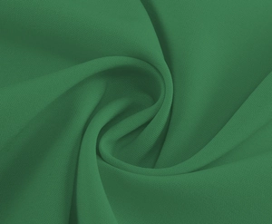 Detailed macro view of dark green woven fabric texture with elegant pleated drape effect