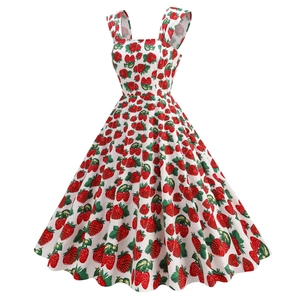 Close-up of vintage 50s square neck dress with vibrant strawberry and leaf print details