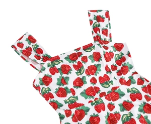 Detail shot of vintage square neck dress featuring realistic red strawberry patterns