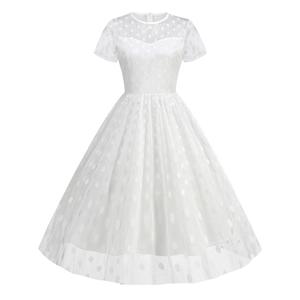 White vintage 50s Audrey Hepburn cocktail dress with polka dot mesh and A-line cut