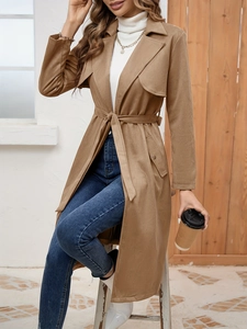 Detail view of brown faux suede long trench coat with waist belt and lapel collar