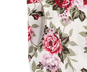 Detailed macro view of the vintage pink rose floral print fabric and side pocket stitching