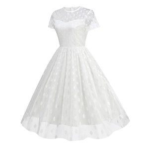 Detail of white 50s vintage cocktail dress showing sheer polka dot mesh neckline and sleeves
