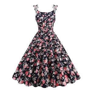 Vintage 1950s floral A-line cocktail dress with rose print and bow shoulder straps
