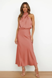 Detail of the high-neck halter neckline and elegant draped pleats on satin dress