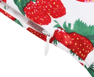 Detail of invisible zipper closure on retro floral dress with vibrant strawberry print