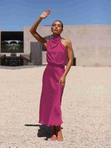Detail of elegant magenta satin maxi dress with a sophisticated halter neckline