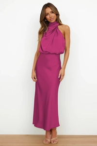 Detail of elegant magenta satin halter neck maxi dress featuring pleated collar texture