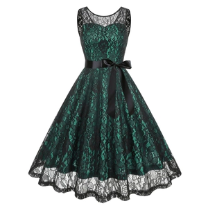 Robe cocktail vintage années 50 en dentelle verte et noire avec ceinture en satin