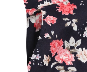 Close-up of vintage floral print dress featuring a functional side pocket and neat stitching
