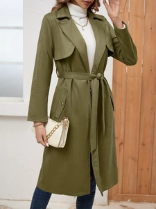 Detailed close-up of army green faux suede trench coat with adjustable waist tie and lapels