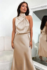 Detail of elegant champagne satin sleeveless dress with a draped cowl neck and silky finish