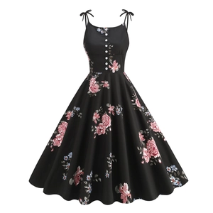 Retro 1950s floral cocktail dress with bow straps and decorative buttons in A-line cut