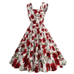 Detailed close-up of retro red rose floral print on white A-line Hepburn style dress