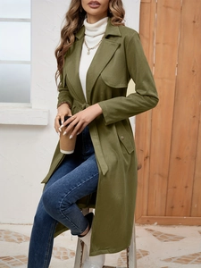 Detail of army green suede trench coat showing lapels, belt, and soft fabric texture