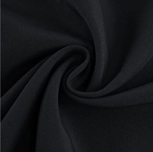 Macro detail of high-quality black striped fabric with elegant spiral texture fold