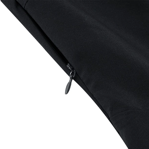 Detail of high-quality invisible zipper on black vintage V-neck striped dress